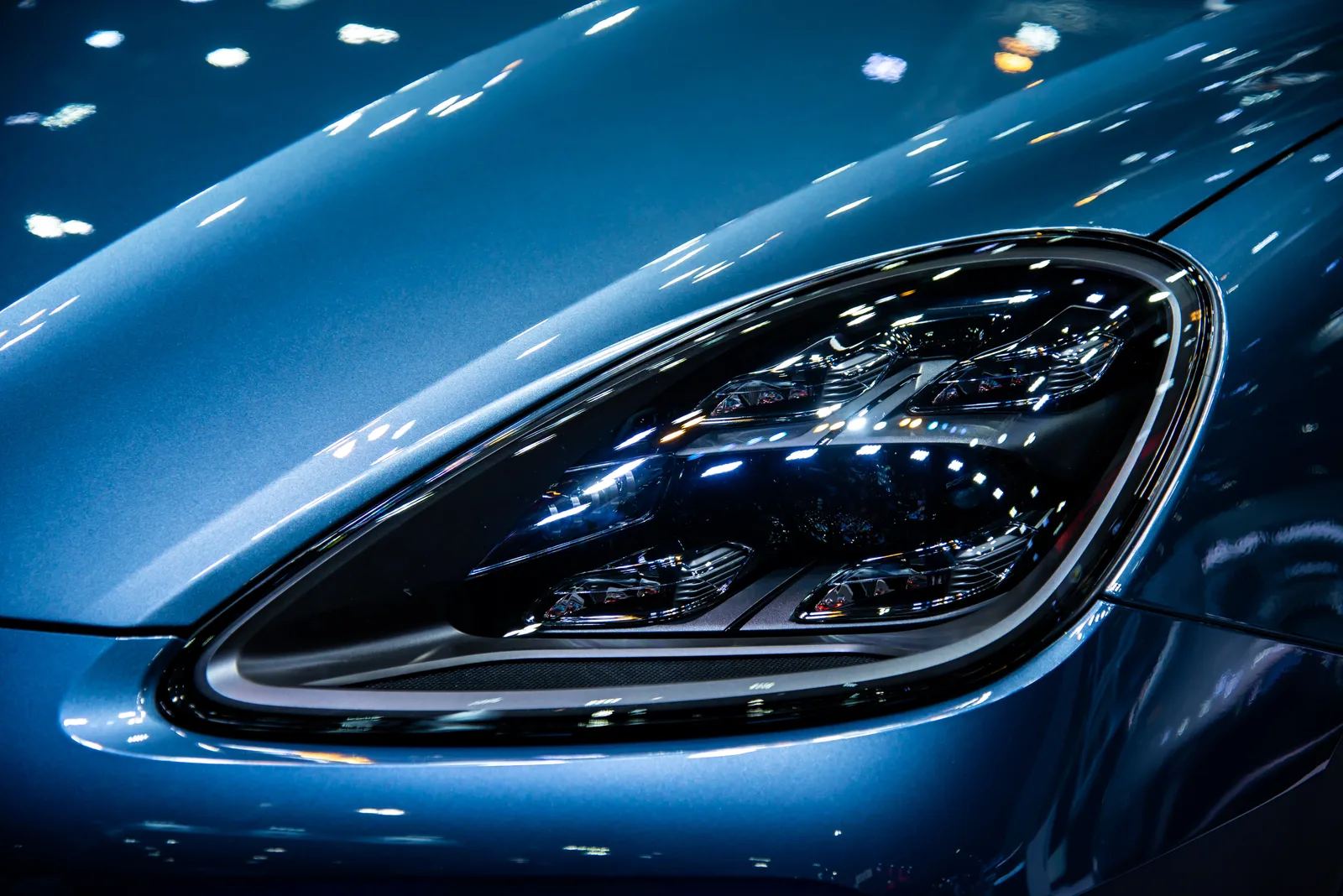 What is the J-Curve in luxury car depreciation?